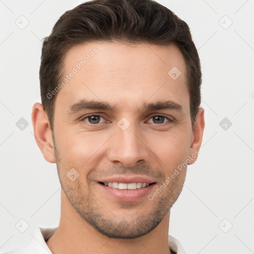 Joyful white young-adult male with short  brown hair and brown eyes