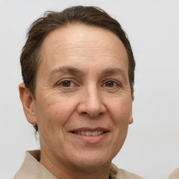 Joyful white adult female with short  brown hair and brown eyes