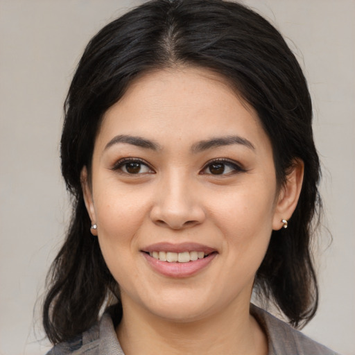 Joyful asian young-adult female with medium  black hair and brown eyes