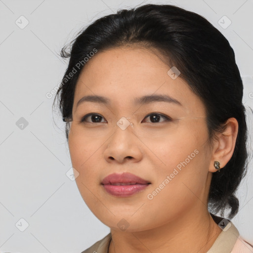 Joyful asian young-adult female with medium  brown hair and brown eyes