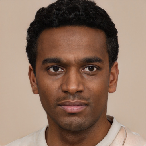 Neutral black young-adult male with short  black hair and brown eyes