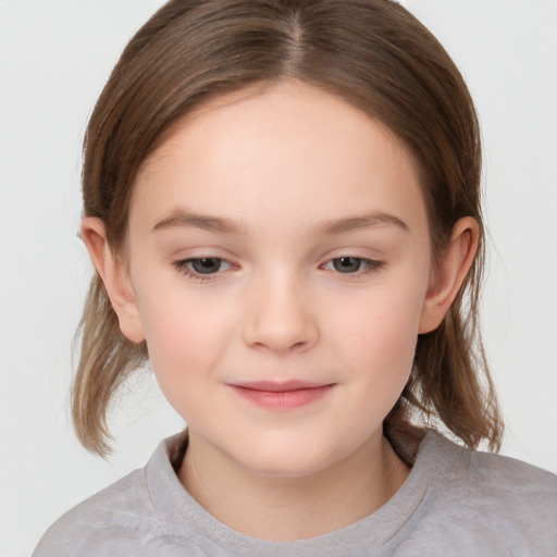 Joyful white child female with medium  brown hair and brown eyes