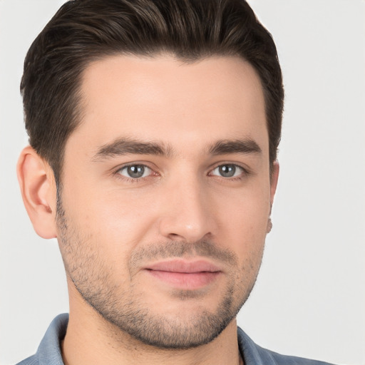 Joyful white young-adult male with short  brown hair and brown eyes