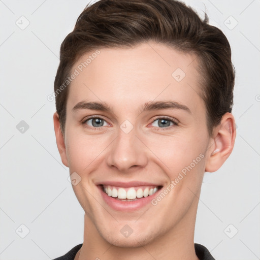 Joyful white young-adult female with short  brown hair and grey eyes