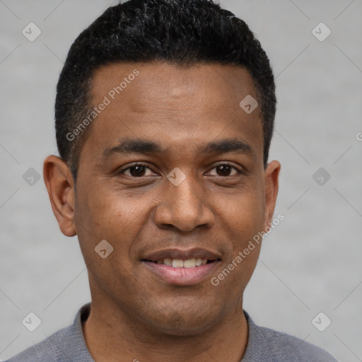 Joyful black young-adult male with short  black hair and brown eyes