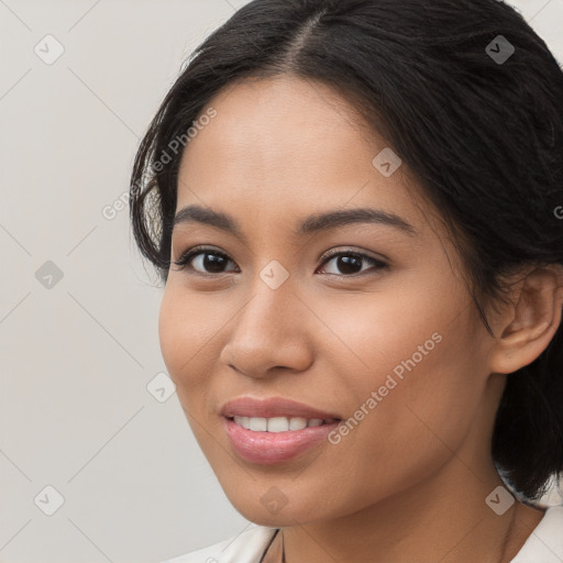 Joyful latino young-adult female with long  brown hair and brown eyes