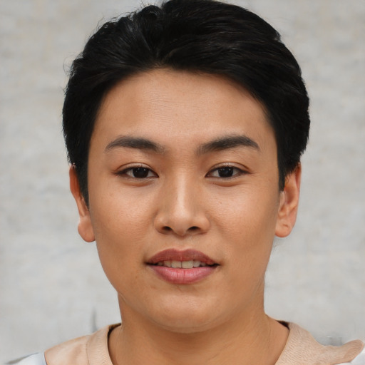 Joyful asian young-adult female with short  black hair and brown eyes