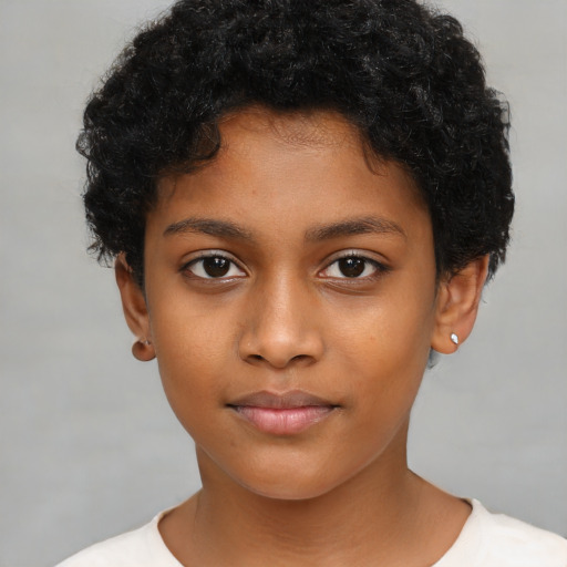 Joyful black child female with short  brown hair and brown eyes