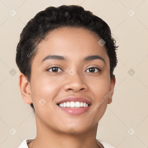 Joyful latino young-adult female with short  black hair and brown eyes