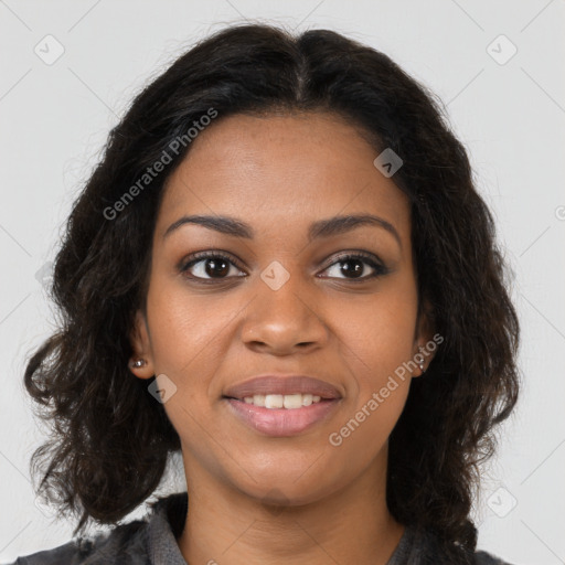 Joyful black young-adult female with long  brown hair and brown eyes