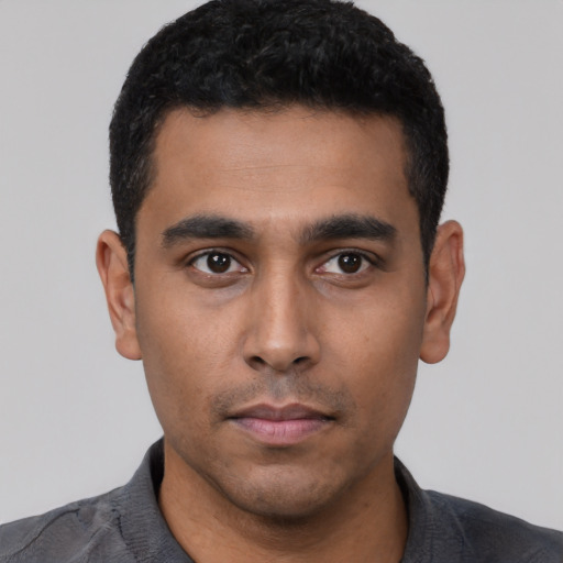 Neutral latino young-adult male with short  black hair and brown eyes