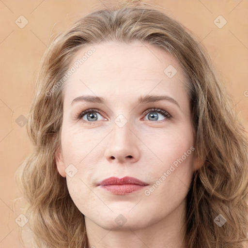 Joyful white young-adult female with medium  brown hair and green eyes