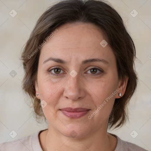 Joyful white adult female with medium  brown hair and brown eyes