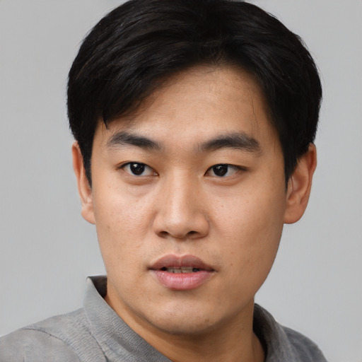 Neutral asian young-adult male with short  black hair and brown eyes