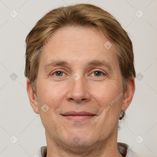 Joyful white adult male with short  brown hair and grey eyes