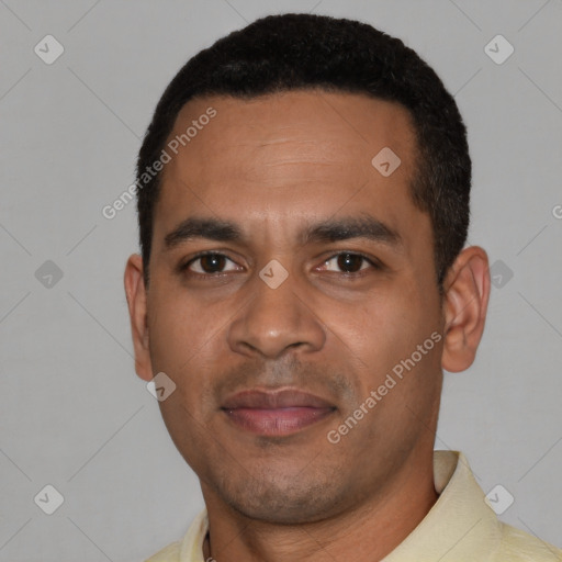 Joyful black young-adult male with short  black hair and brown eyes