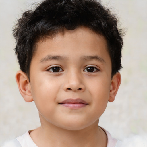 Joyful white child male with short  brown hair and brown eyes