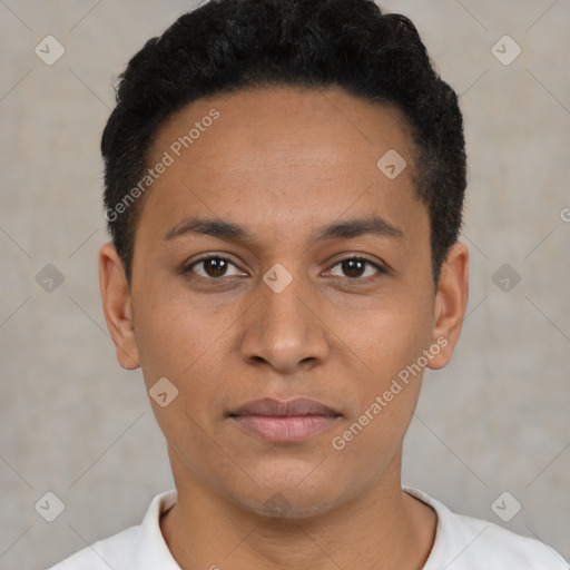 Joyful latino young-adult male with short  brown hair and brown eyes