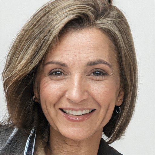 Joyful white adult female with long  brown hair and brown eyes