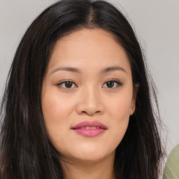 Joyful asian young-adult female with long  brown hair and brown eyes