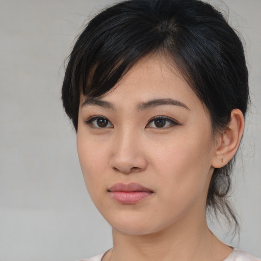 Neutral asian young-adult female with medium  brown hair and brown eyes