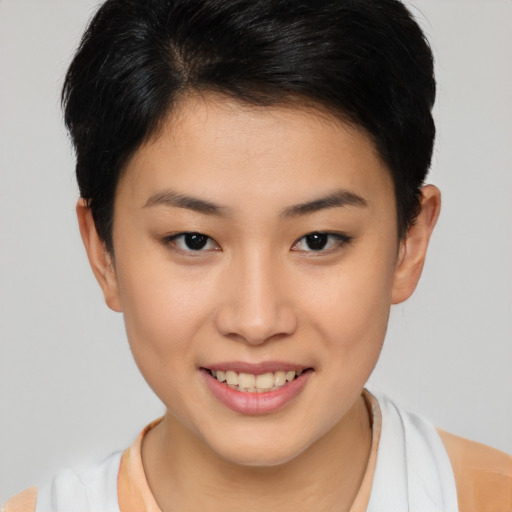 Joyful asian young-adult female with short  brown hair and brown eyes