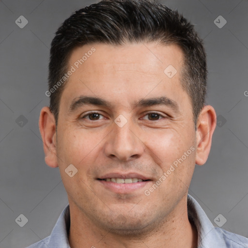 Joyful white adult male with short  brown hair and brown eyes