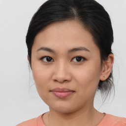 Joyful asian young-adult female with medium  brown hair and brown eyes