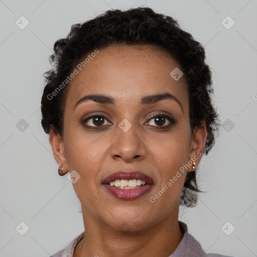 Joyful black young-adult female with short  brown hair and brown eyes