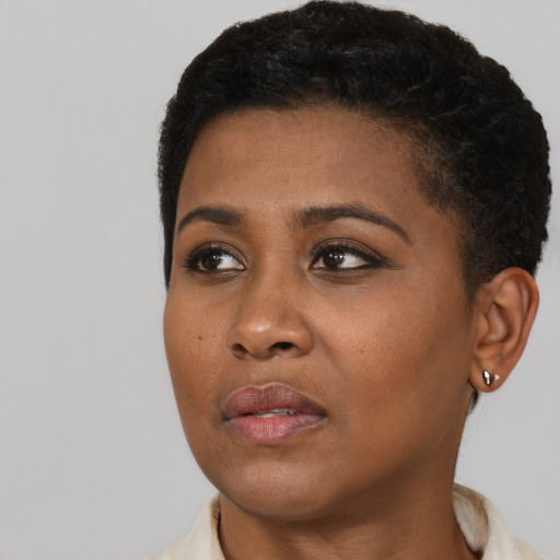 Neutral black young-adult female with short  black hair and brown eyes