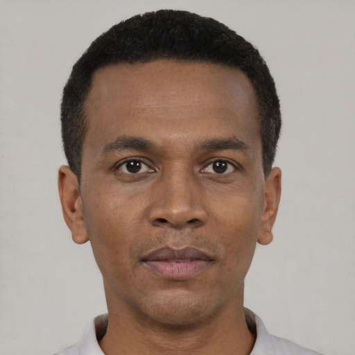 Neutral black young-adult male with short  black hair and brown eyes