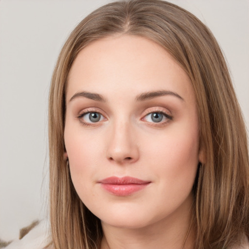 Neutral white young-adult female with long  brown hair and grey eyes