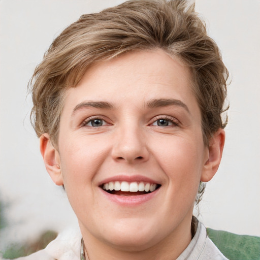 Joyful white young-adult female with short  brown hair and grey eyes