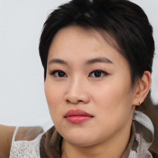 Neutral asian young-adult female with medium  black hair and brown eyes