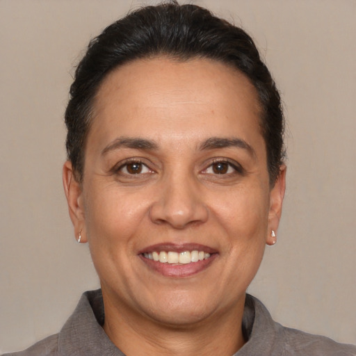 Joyful white adult female with short  brown hair and brown eyes