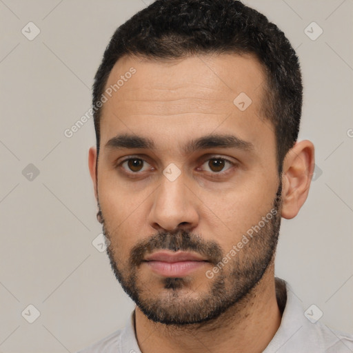 Neutral white young-adult male with short  black hair and brown eyes