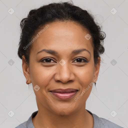 Joyful latino adult female with short  brown hair and brown eyes