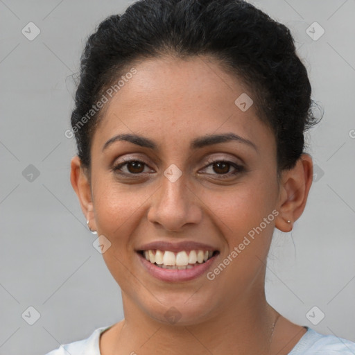 Joyful latino young-adult female with short  brown hair and brown eyes