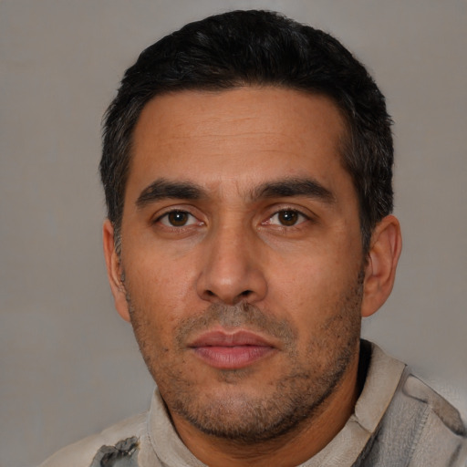 Neutral latino young-adult male with short  black hair and brown eyes