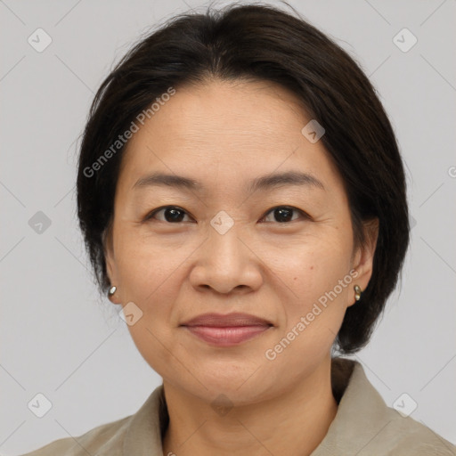 Joyful white adult female with medium  brown hair and brown eyes