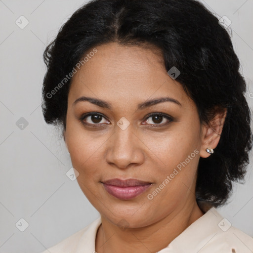 Joyful latino adult female with medium  brown hair and brown eyes