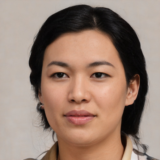 Joyful asian young-adult female with medium  black hair and brown eyes