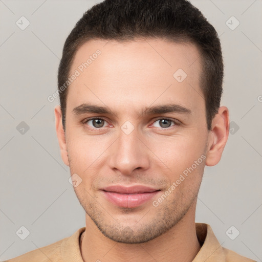 Joyful white young-adult male with short  brown hair and brown eyes