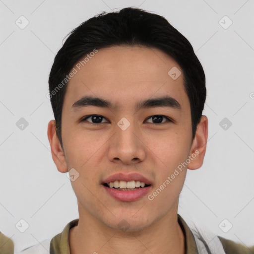 Joyful asian young-adult male with short  black hair and brown eyes