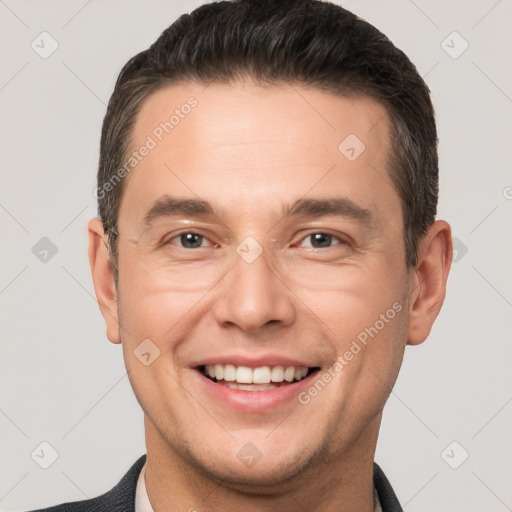 Joyful white adult male with short  brown hair and brown eyes