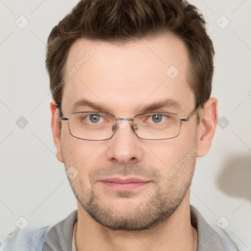 Joyful white young-adult male with short  brown hair and grey eyes