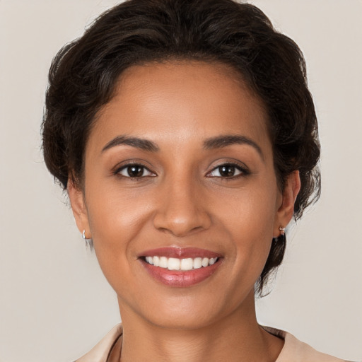 Joyful white young-adult female with medium  brown hair and brown eyes