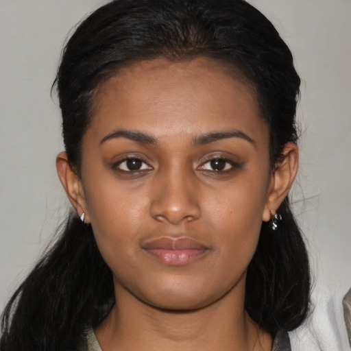 Neutral black young-adult female with medium  black hair and brown eyes