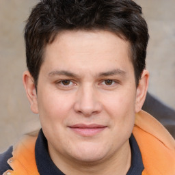 Joyful white young-adult male with short  brown hair and brown eyes