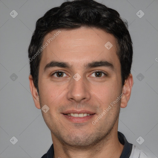 Joyful white young-adult male with short  black hair and brown eyes